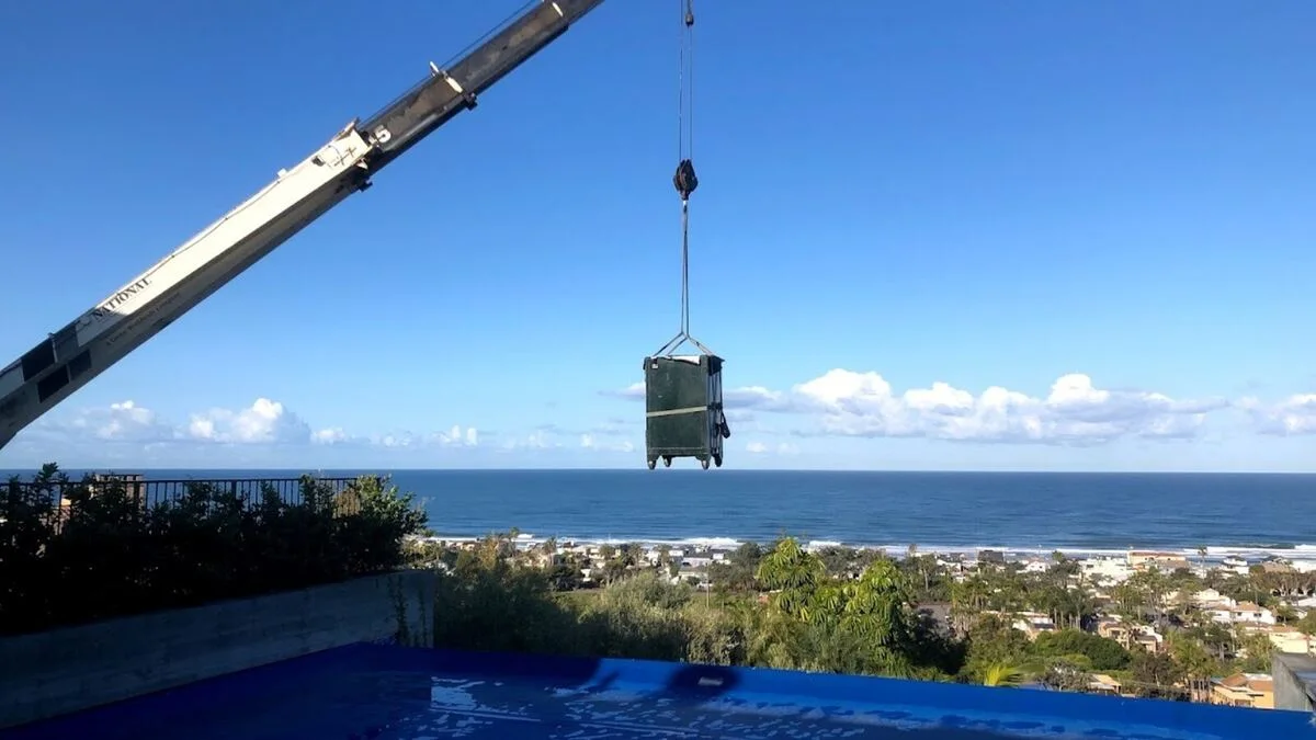 Boswell moving a safe by crane for difficult access in California